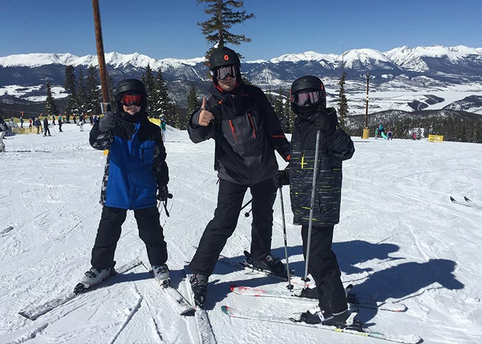 Greg skiing with his twins