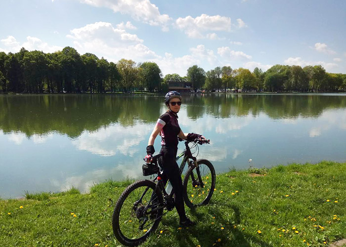 Kinga Maciejczyk - riding bike by pond