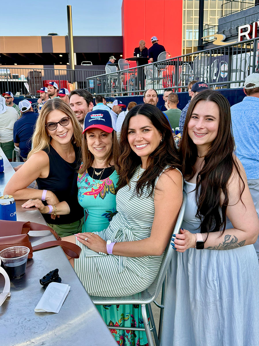 2026-07_CHI-dogs-game_nicole-laura-stacey-aga PCMI staff at baseball game